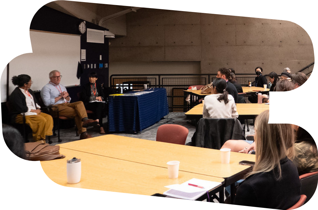 Panel speaking in front of audience